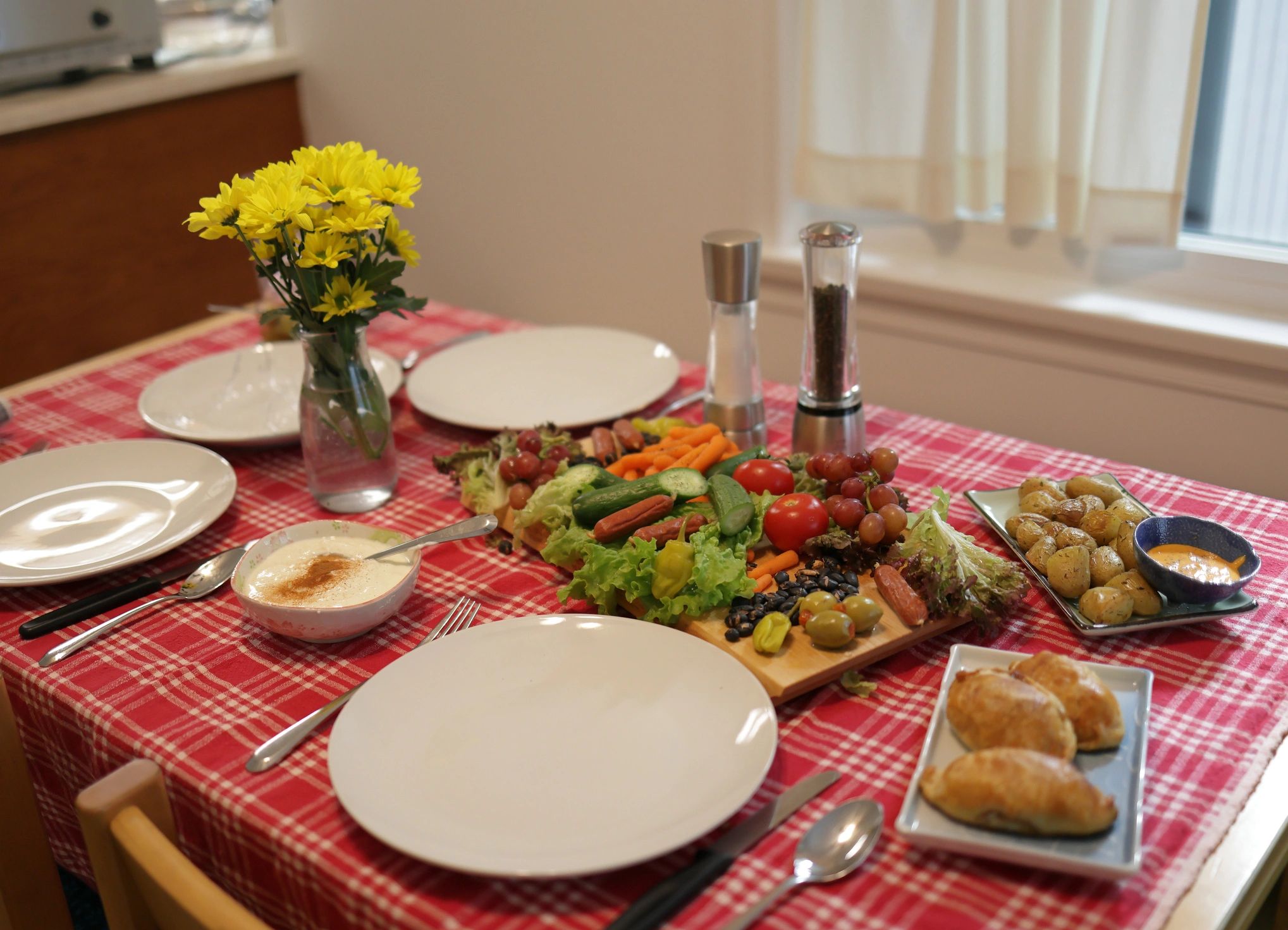 Healthy shared meal on a table, representing a Mediterranean-leaning food pattern